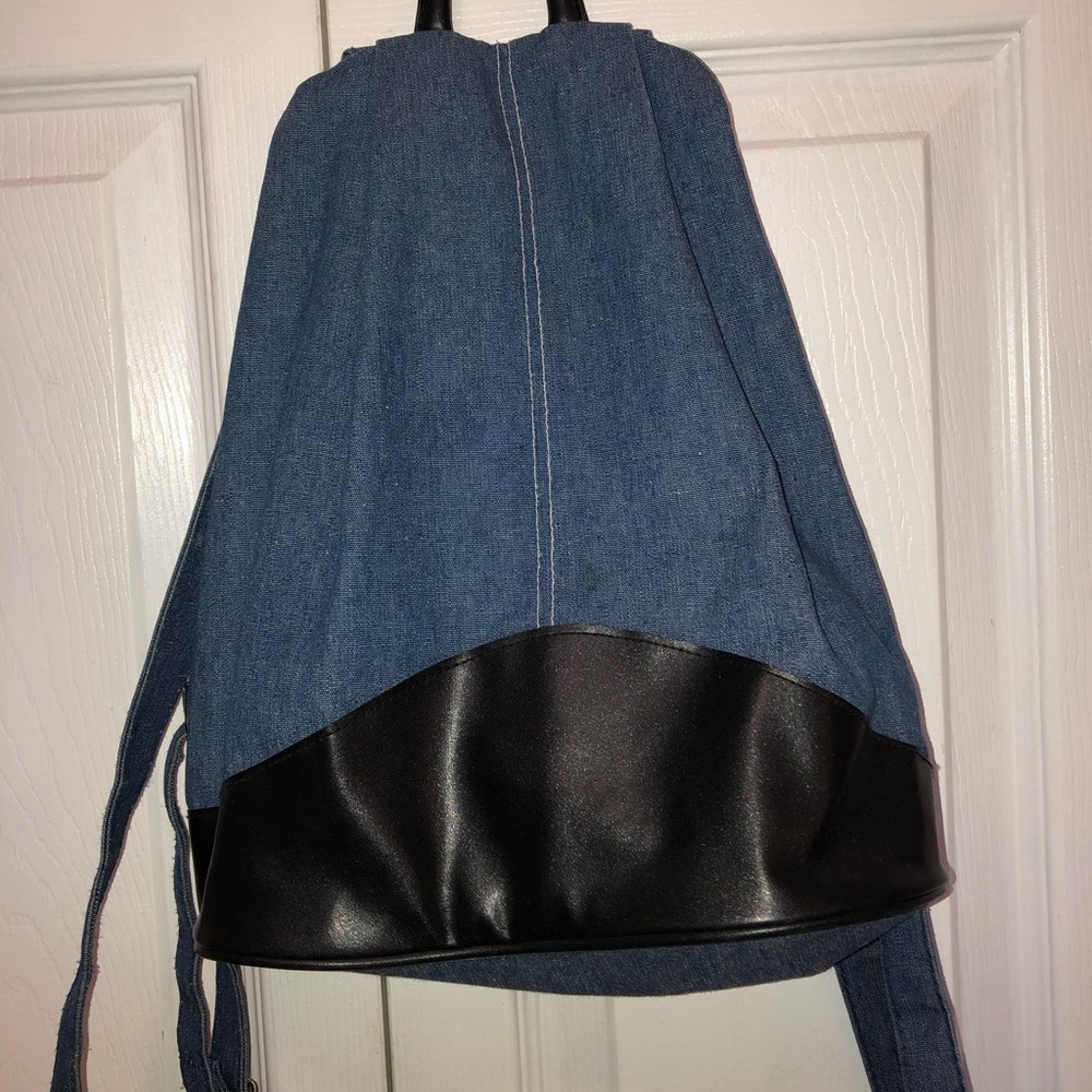 Jean and faux leather backpack